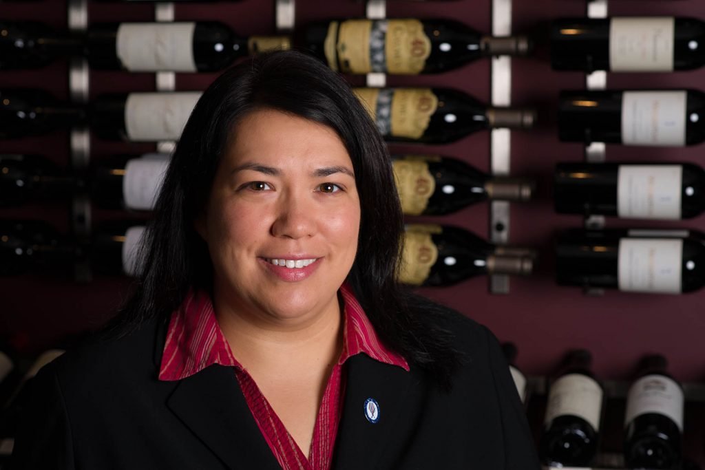 Erika_Frey_wearing_French_Wine_Scholar_pin_from_Wine_Scholar_Guild_Credit_Geoff_Moore_1920x1280-1024x683.jpg